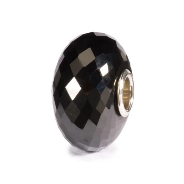 Bead Trollbeads Onice Nero in pietra naturale nera lucida con taglio sfaccettato e inserto in argento 925.