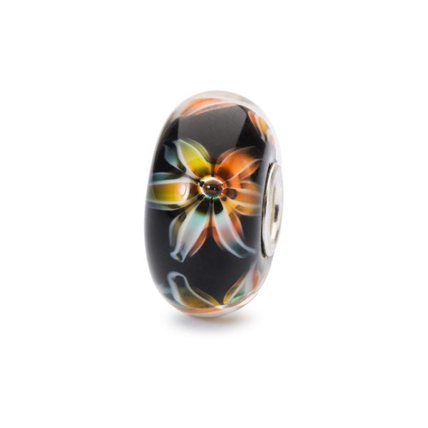 Bead Trollbeads Fiore dello splendore in vetro nero con fiore stilizzato dalle sfumature arancio, gialle e bianche, anima in argento 925.