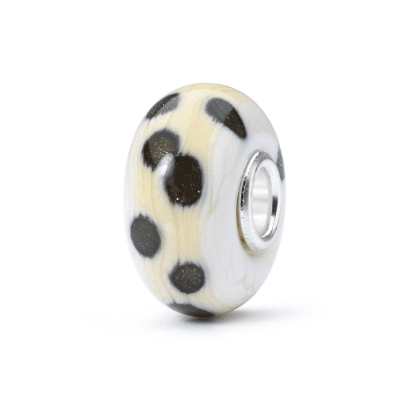 Bead Trollbeads Sentieri Incantati in vetro color crema con macchie scure glitterate, anima in argento 925.